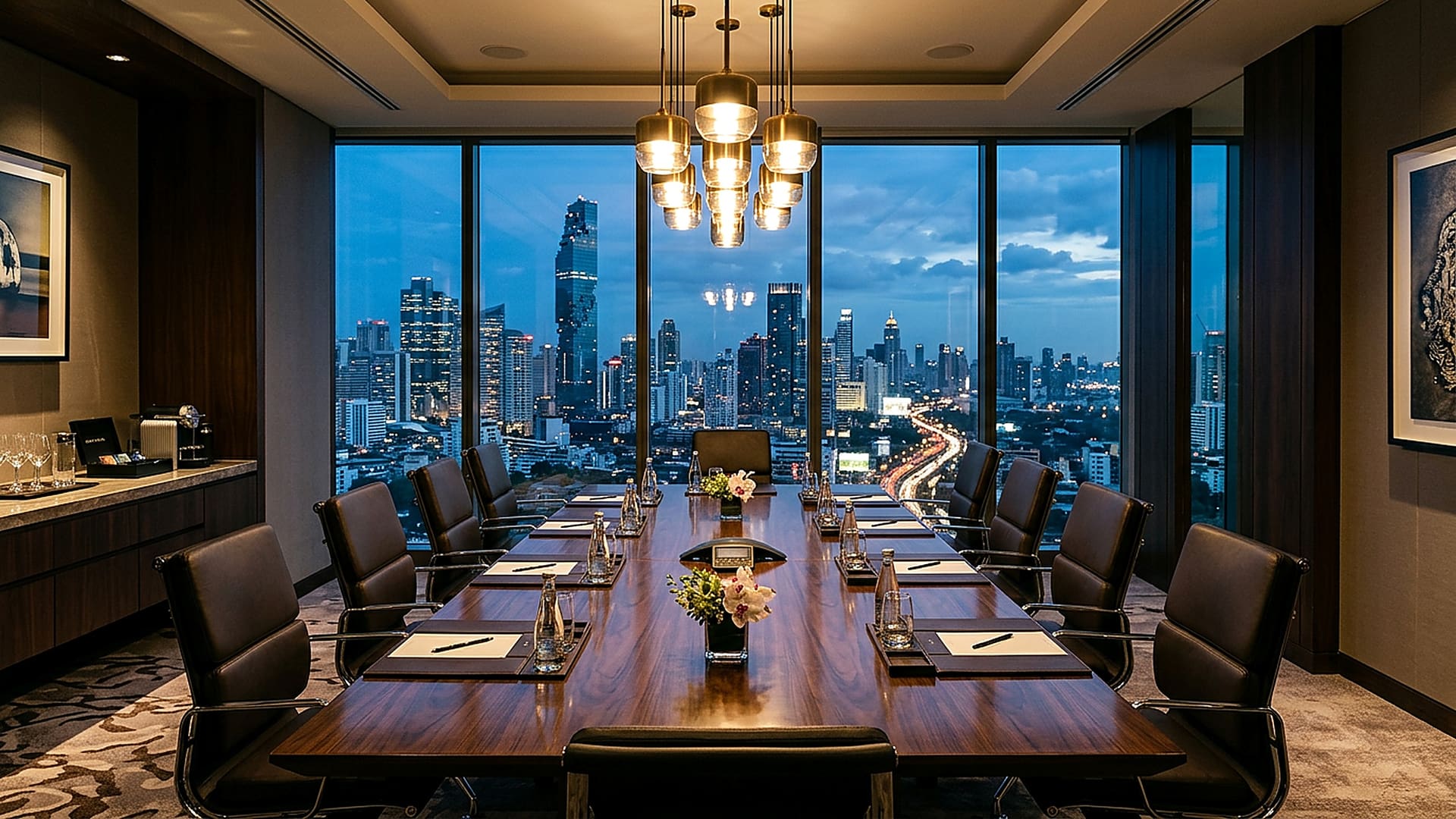 Private Bangkok villa boardroom configured for an executive offsite, with pool view